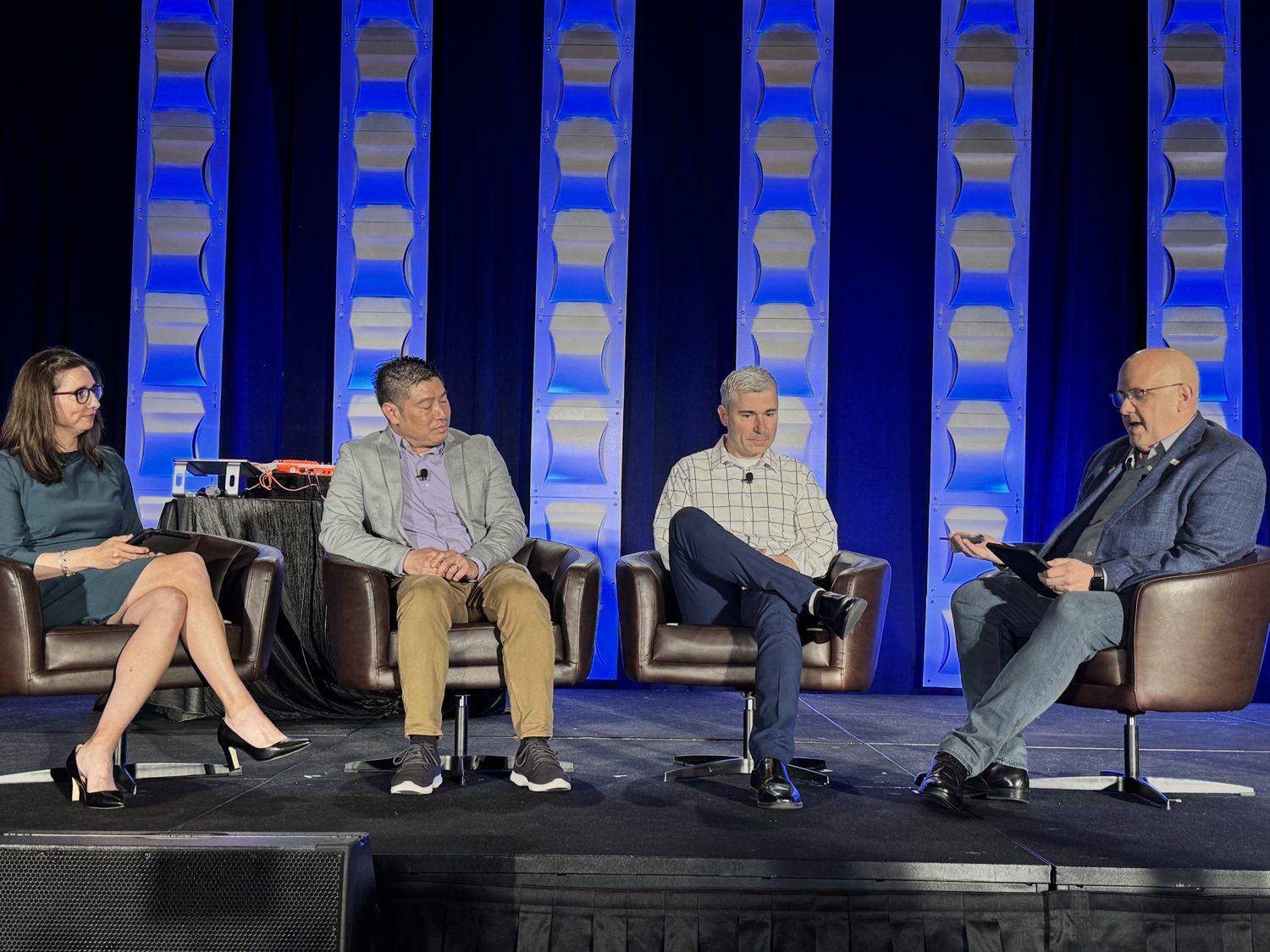 Kris Hagel moderating a four-person panel at CoSN