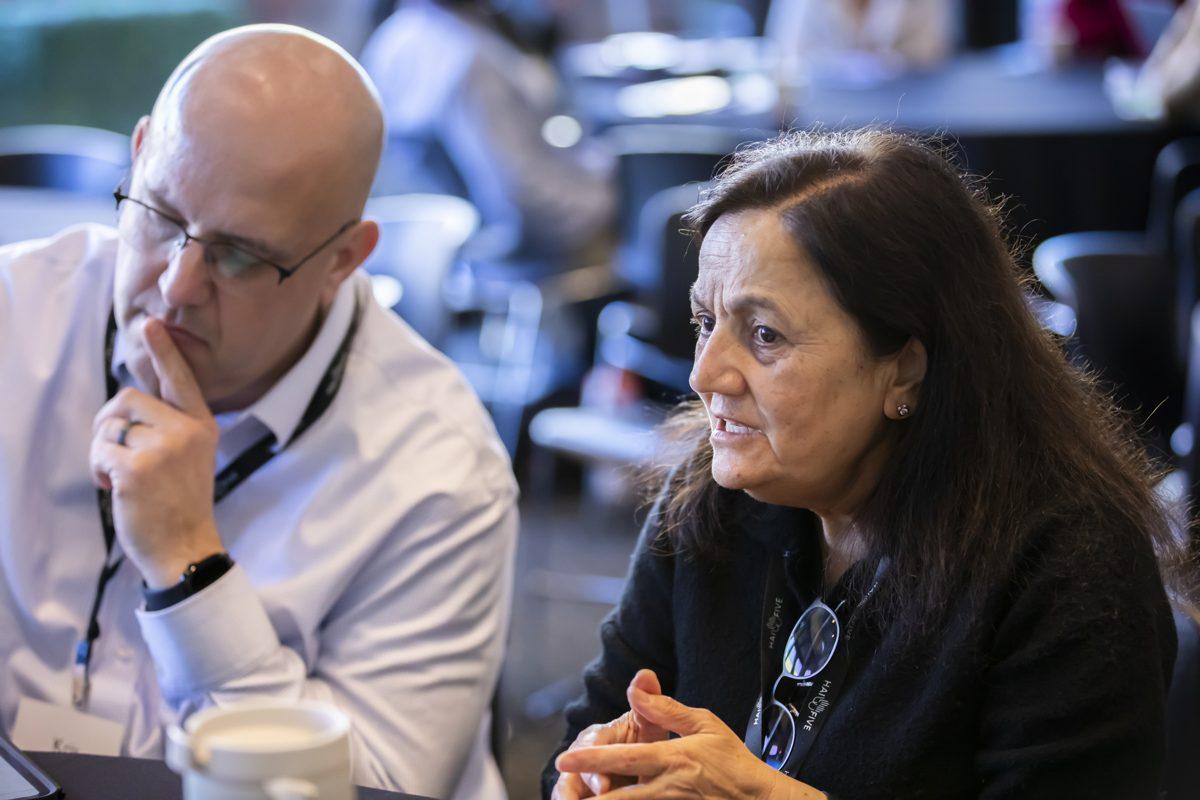 Kris Hagel listening in a roundtable discussion